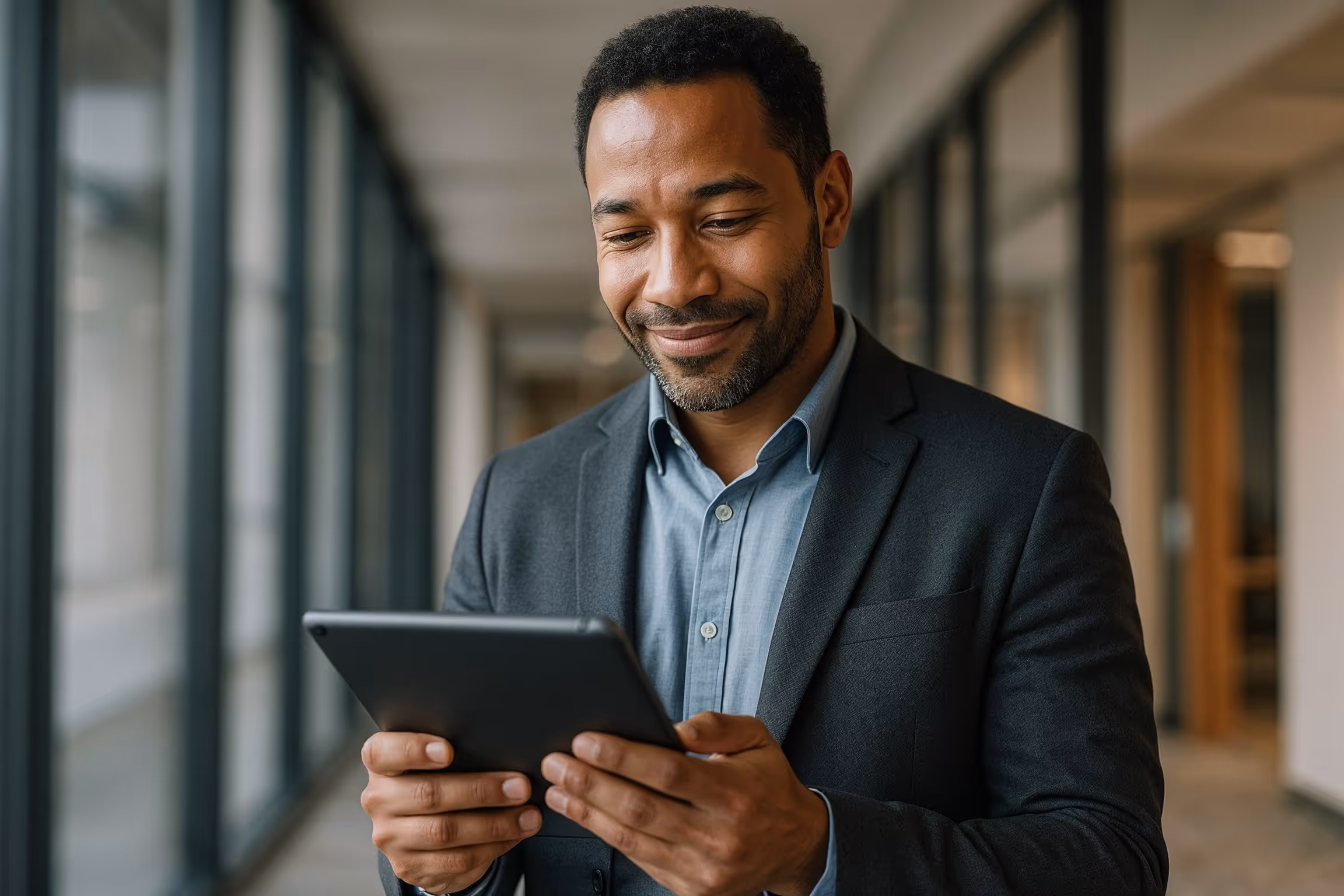 Landing & Advancing Your IT Job: professional reviewing certifications and updating LinkedIn profile in a modern office