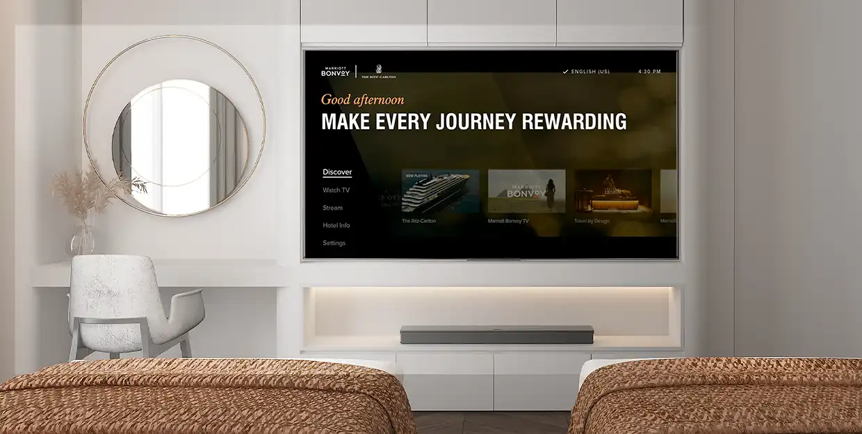 Hotel room showcasing the TV with the Marriott Bonvoy Welcome Screen.