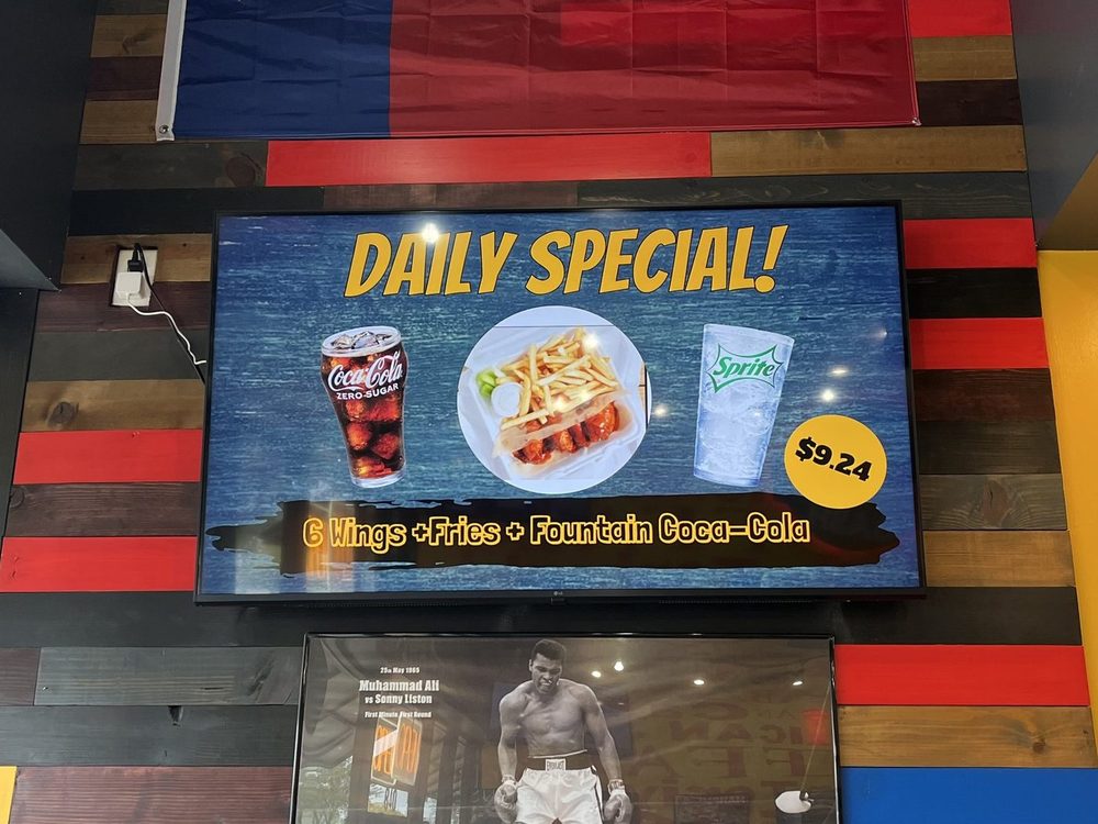 A Daily Special screen with wings, fries and a fountain drink combo at Wing Dash in Dallas