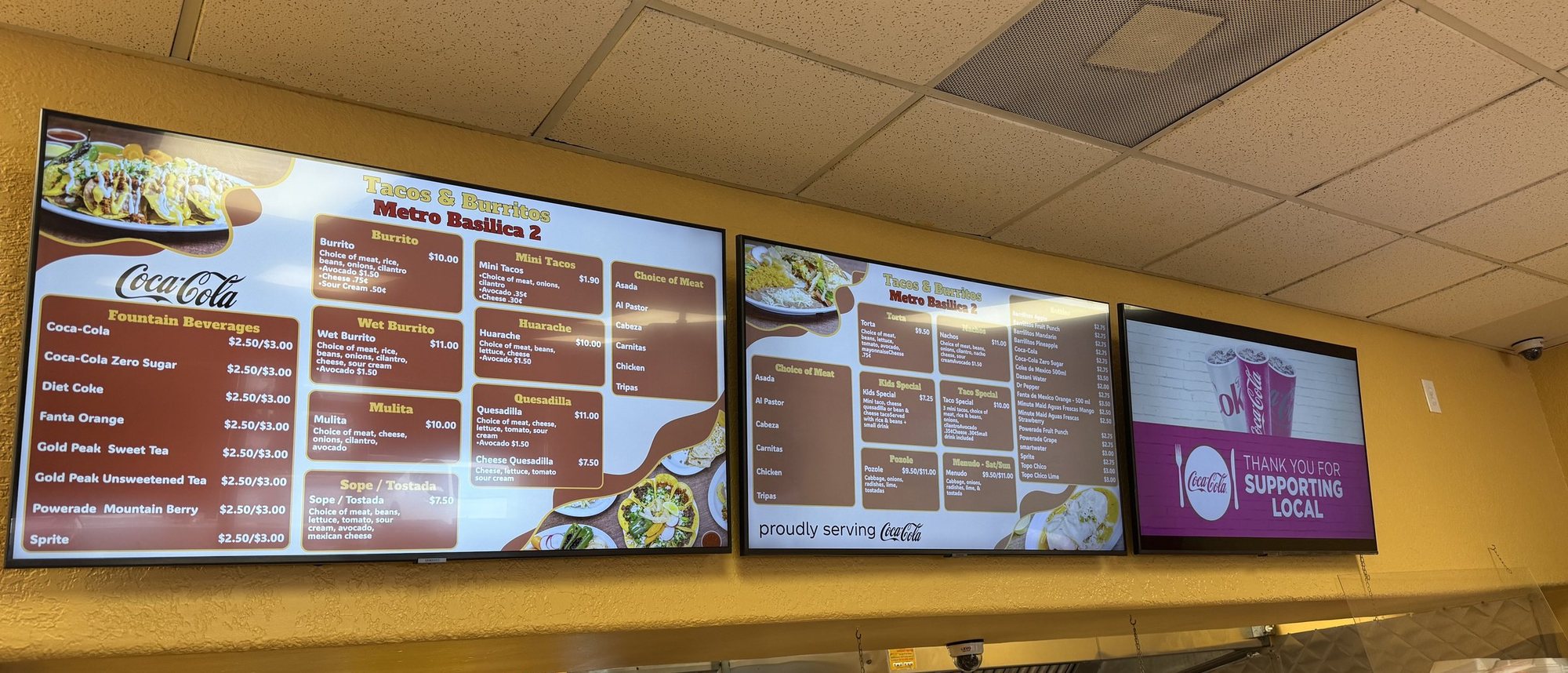 Three menu boards side by side over the counter at Tacos & Burritos Metro Basilica 2 in Phoenix