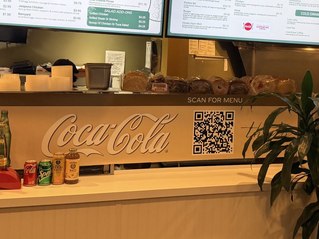 A Scan for menu QR code on the counter at Thistle Cafe in Austin