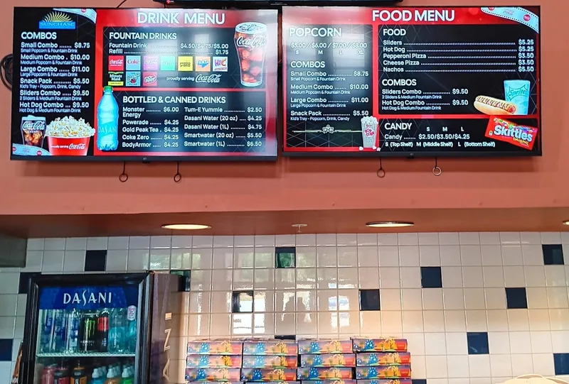 Drink and food menu boards over the concession counter at SunChase Cinemas