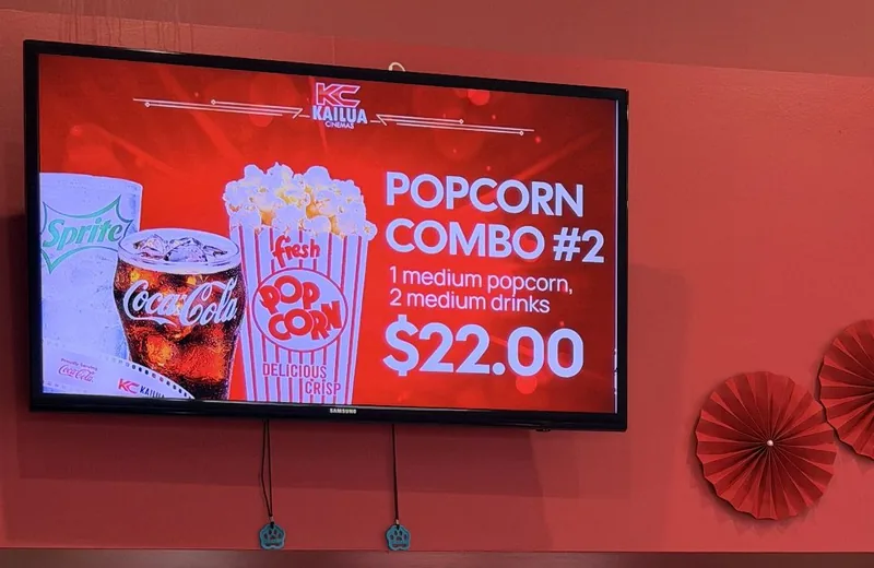 After: a full-screen popcorn combo slide at a cinema concession