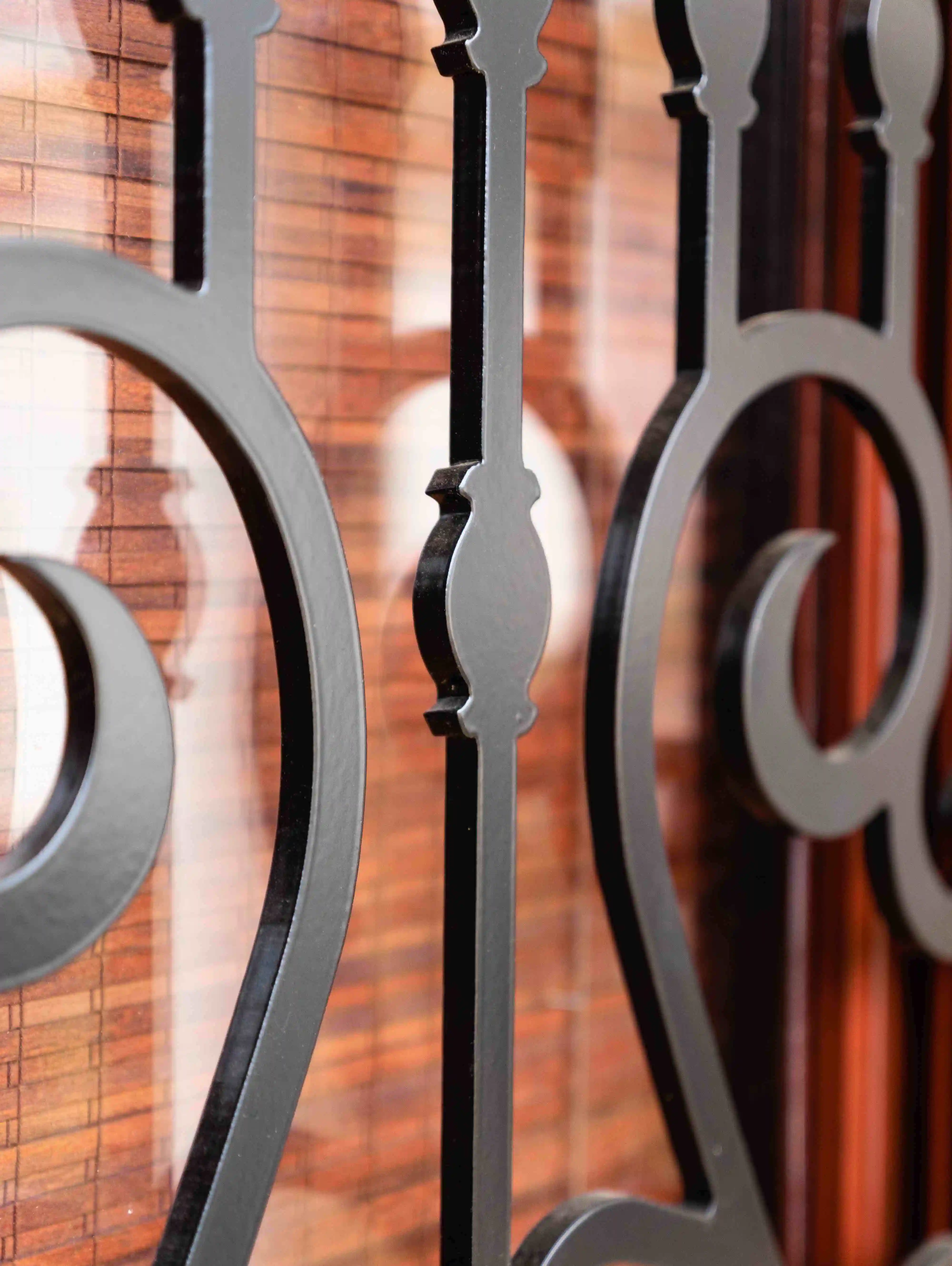 a very close up image of a black iron door