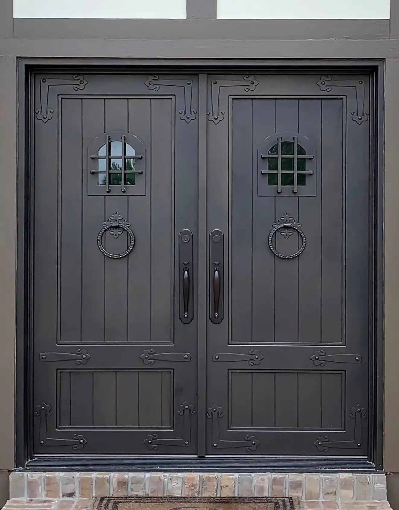 black iron front entry double door of a home