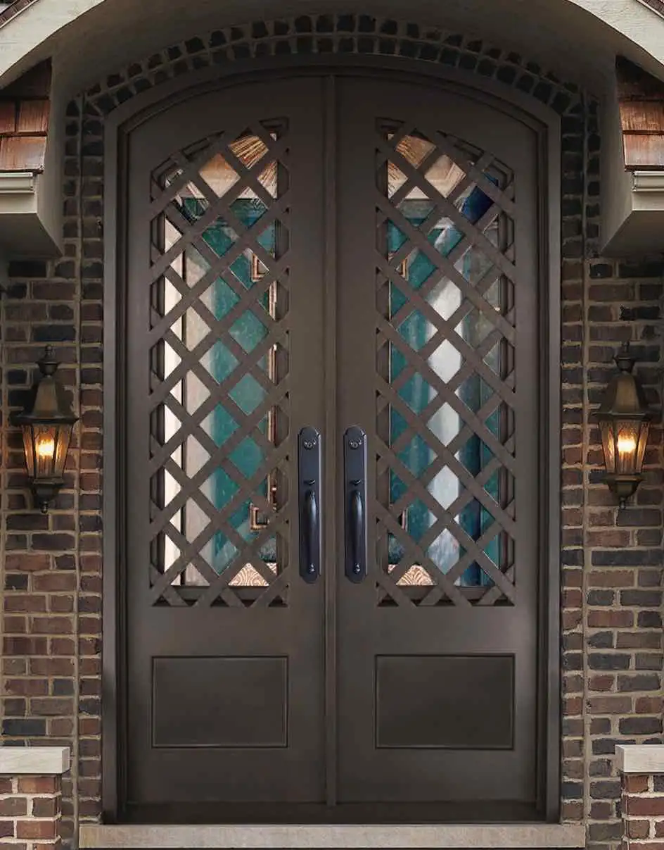 black iron front double entry door of a home with glass panels and lattice pattern overlay