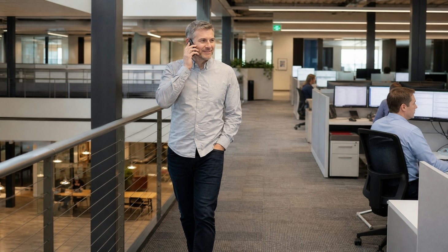 Diverse professionals discussing HAAS, sunny office
