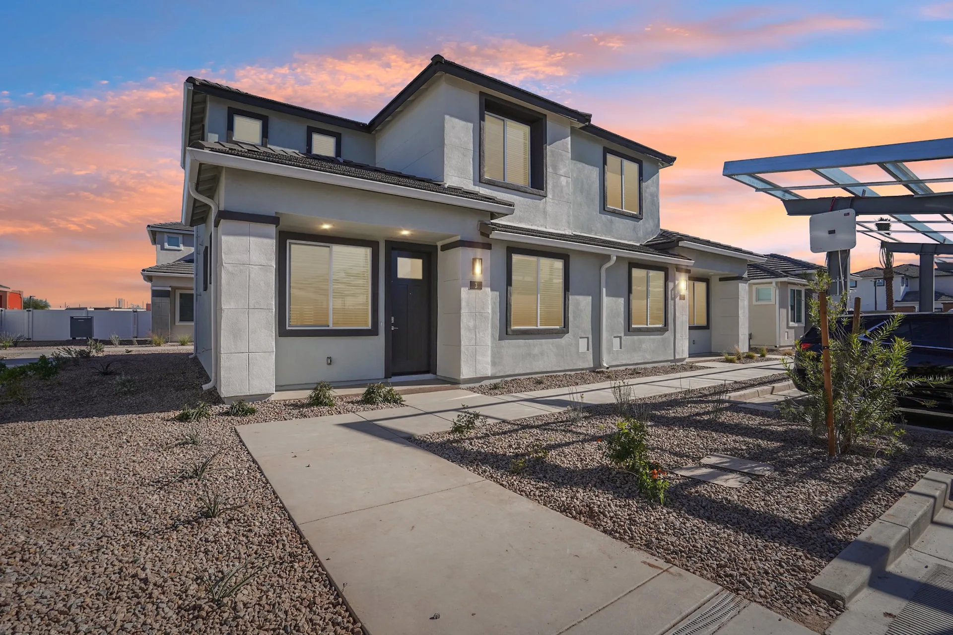 House exterior with sunset behind