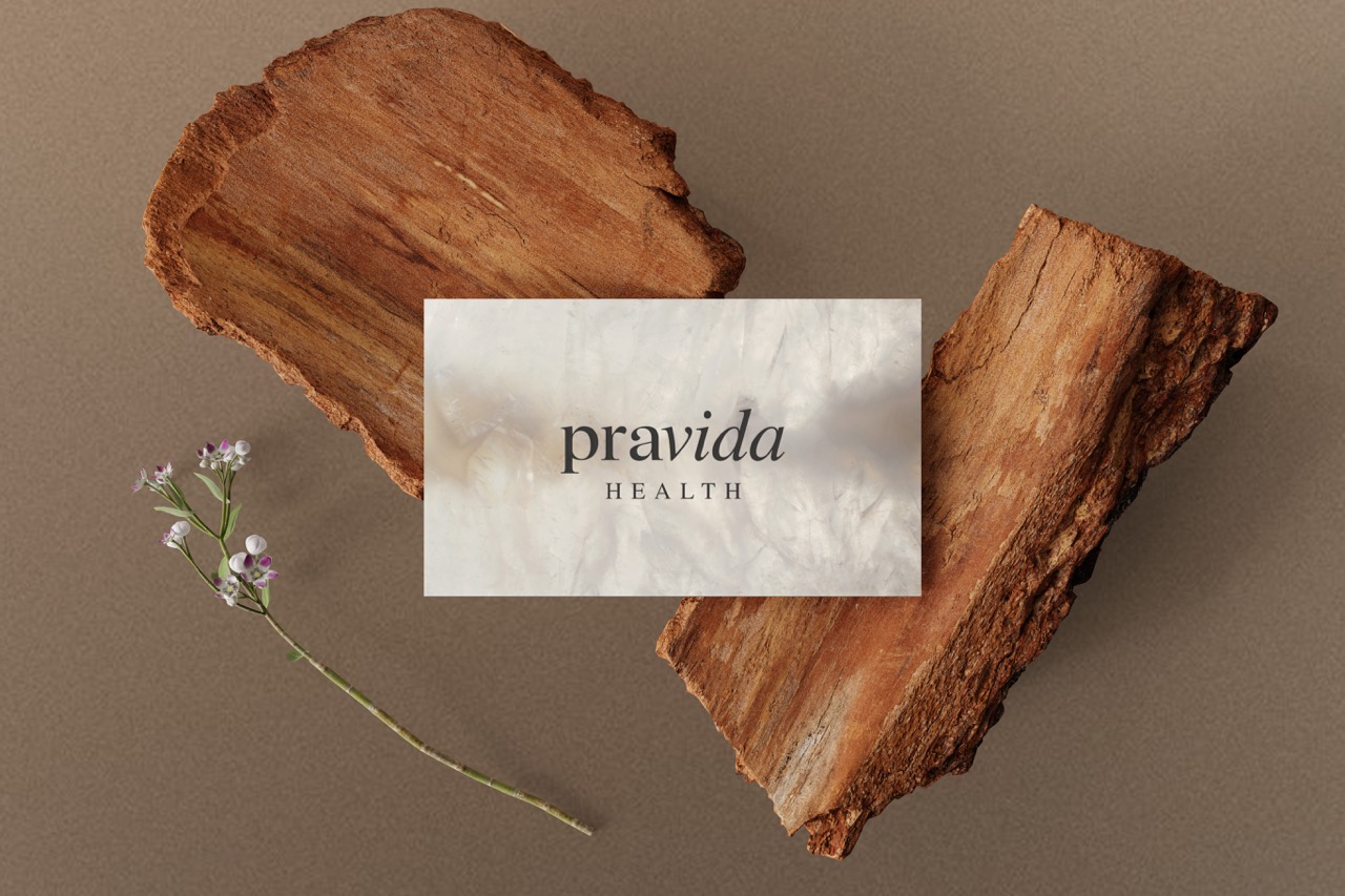 Pravida Health embossed business cards featuring the longevity brand identity created by Tantrum Agency