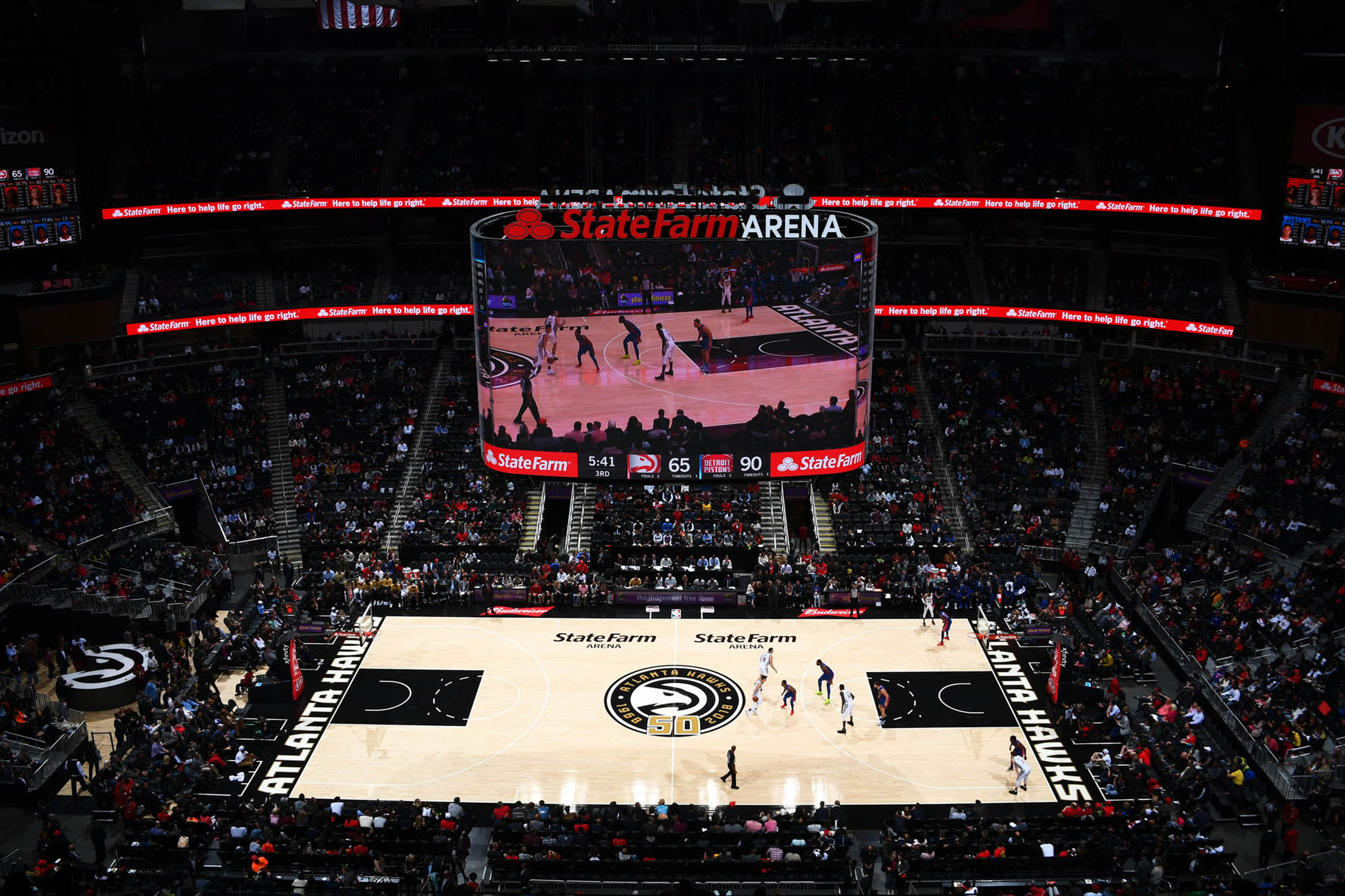 Tantrum Agency Hawks 50th anniversary identity applied across the basketball court and arena experience at State Farm Arena