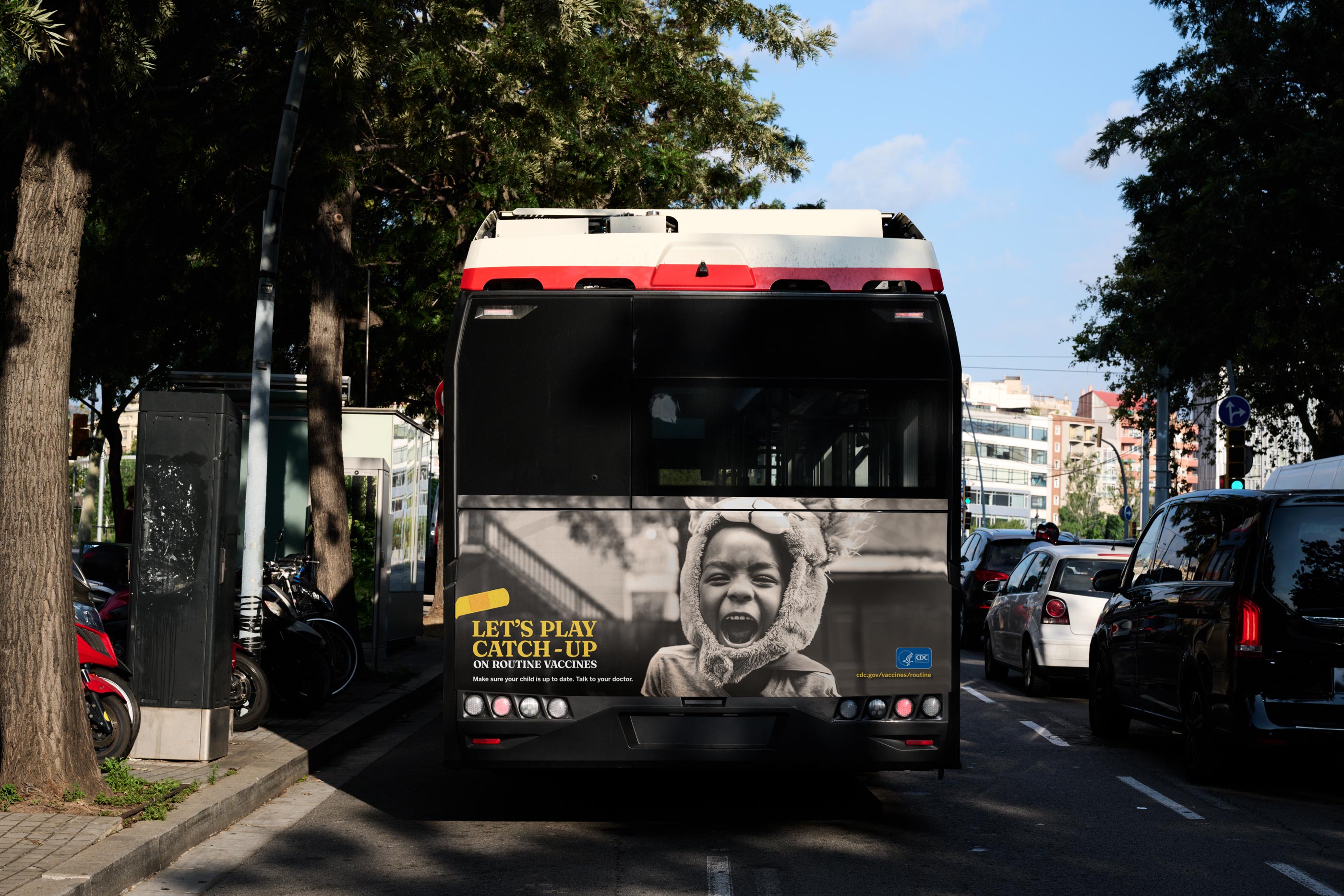 Tantrum Agency Let’s Play Catch-Up campaign for the CDC displayed across a city bus promoting childhood vaccination