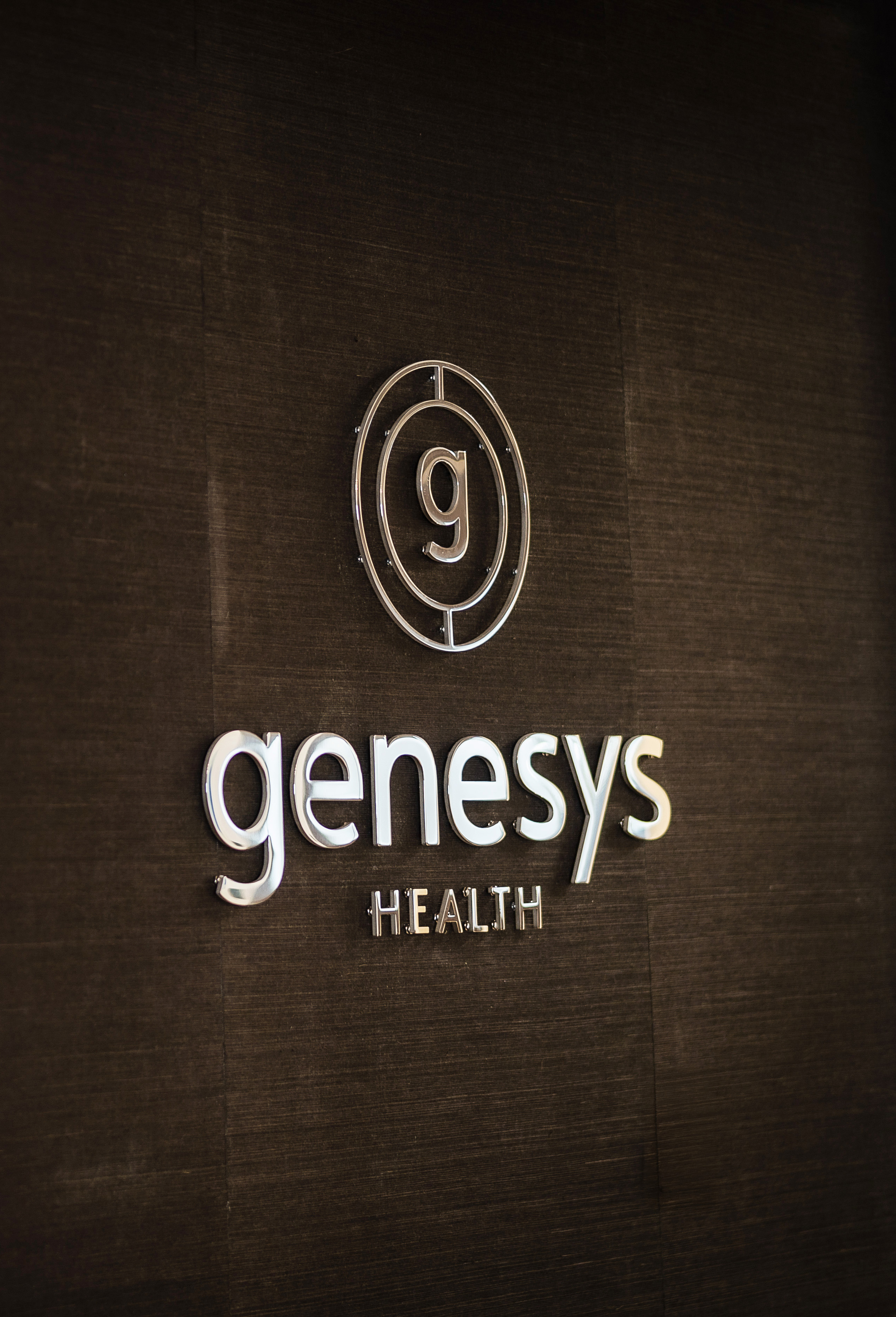 Genesys Health logo and brand identity by Tantrum Agency displayed in an office environment