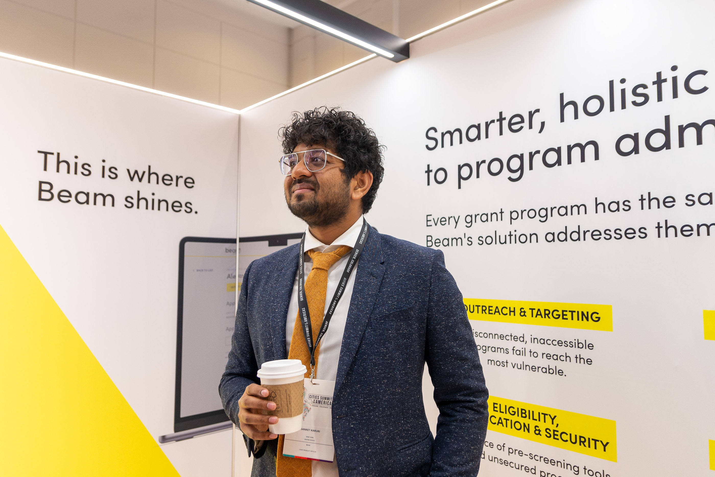 Tantrum Agency Cities Summit experience for Beam featuring an attendee engaging with the branded conference exhibit
