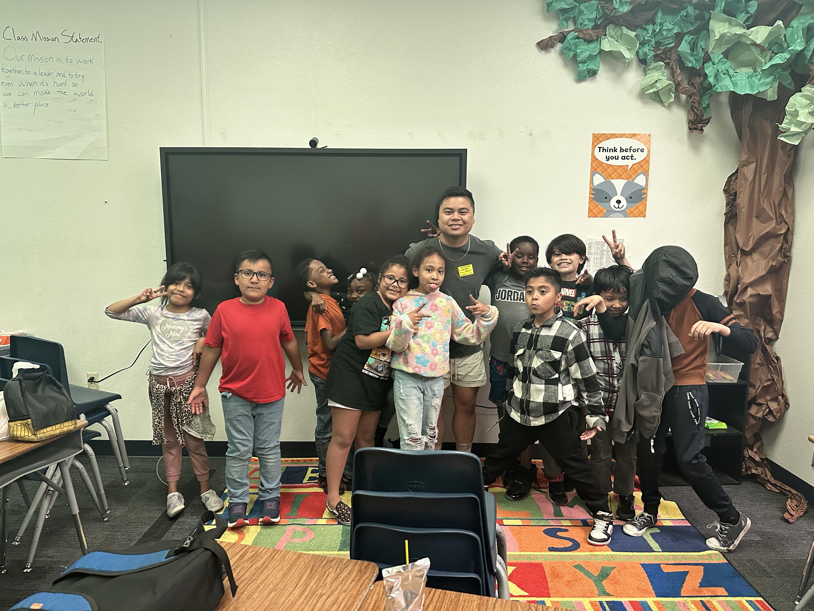 Tantrum Agency team member participating in a hands-on service project at a local elementary school