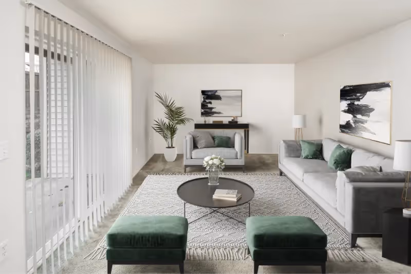 Virtually staged living area with sofa, coffee table, and balcony doors
