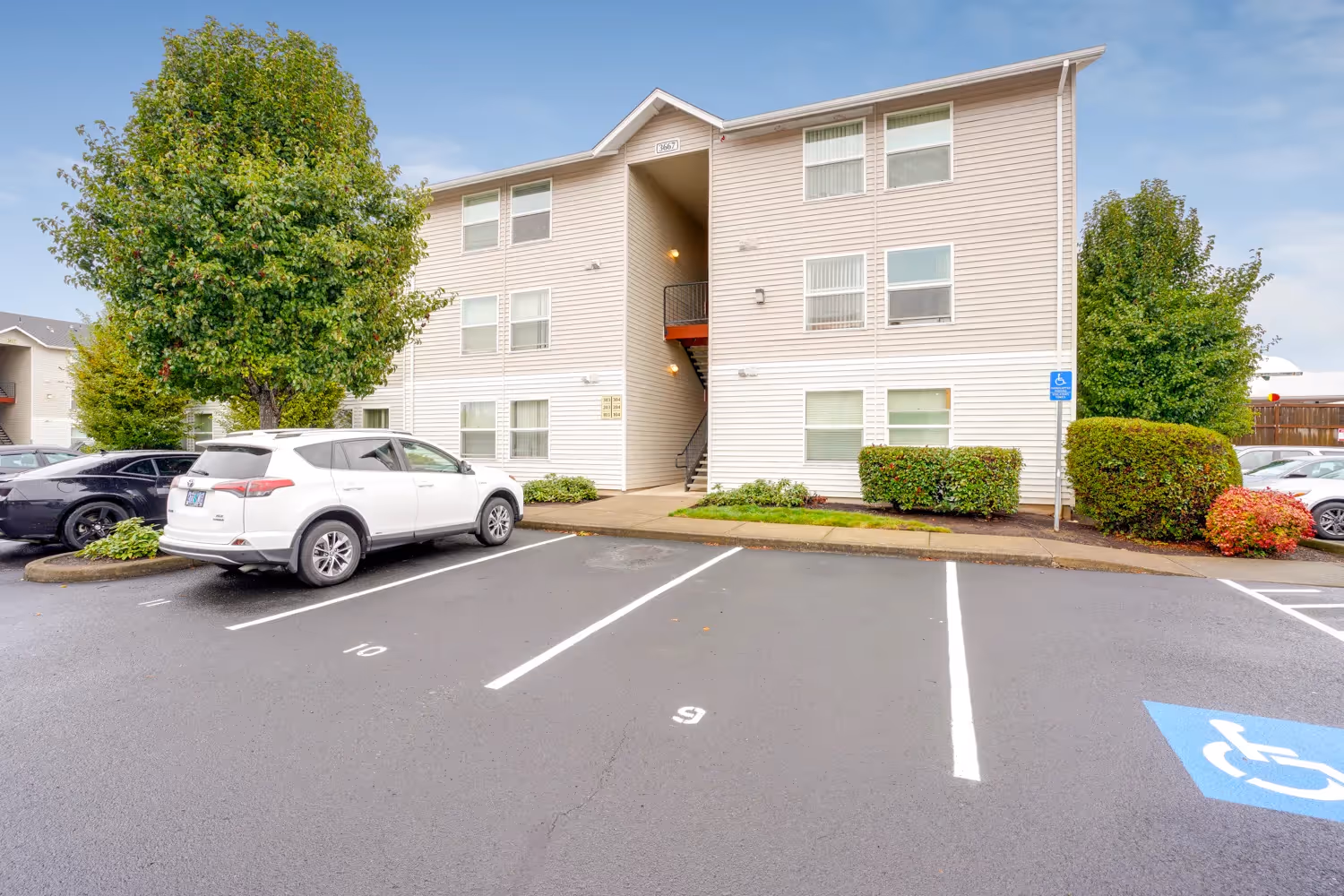 Exterior view with trees and view of parking lot