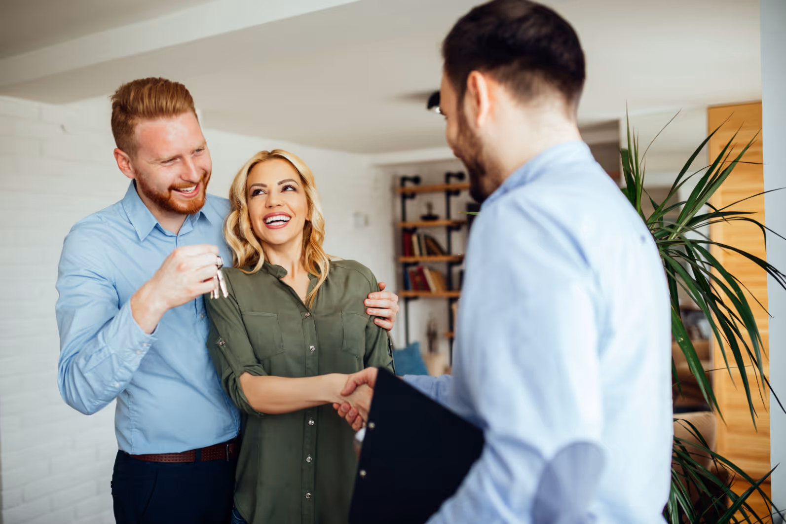 Couple shaking man's hand stock image