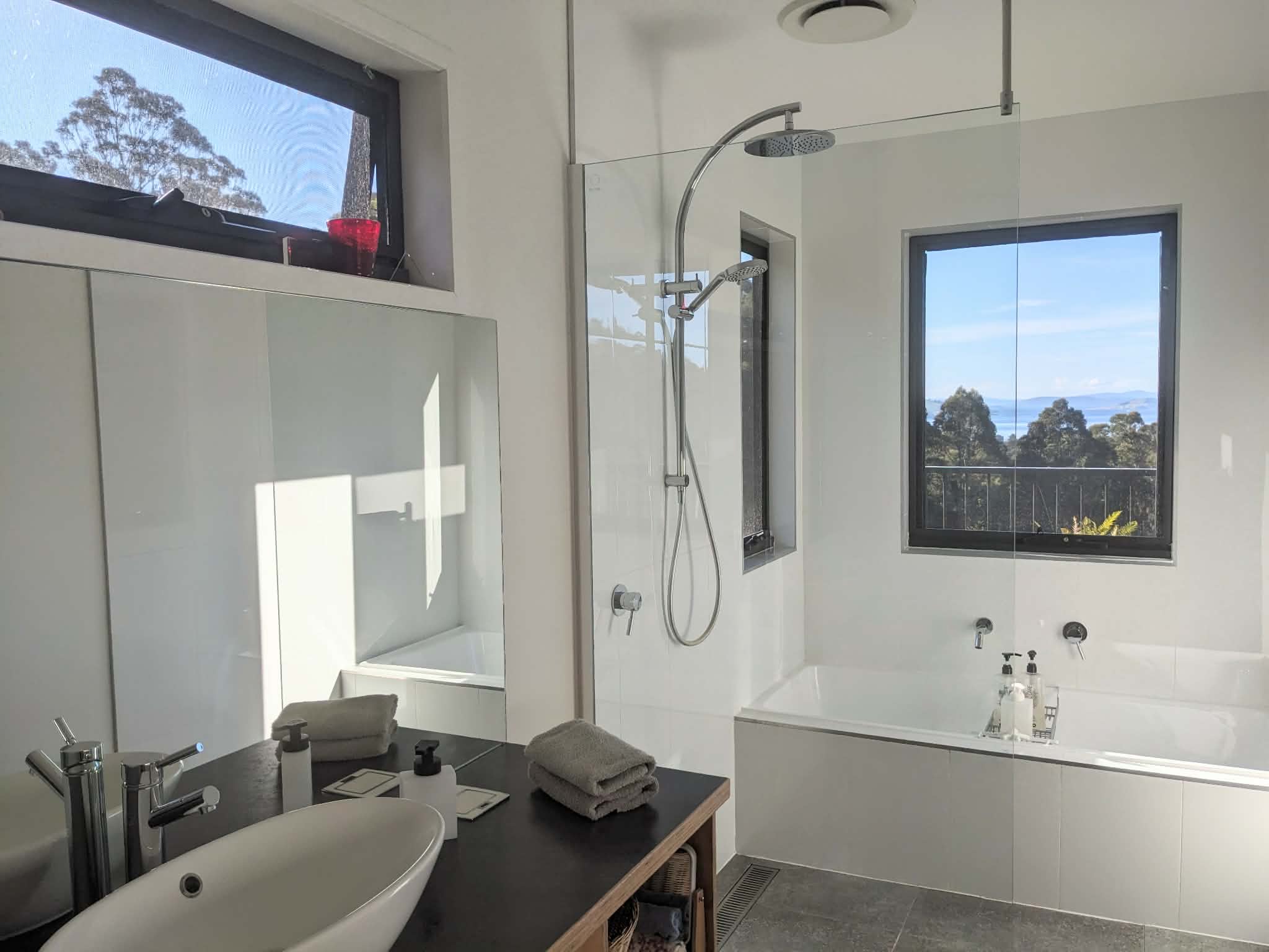 Bathroom with deep bath and a view