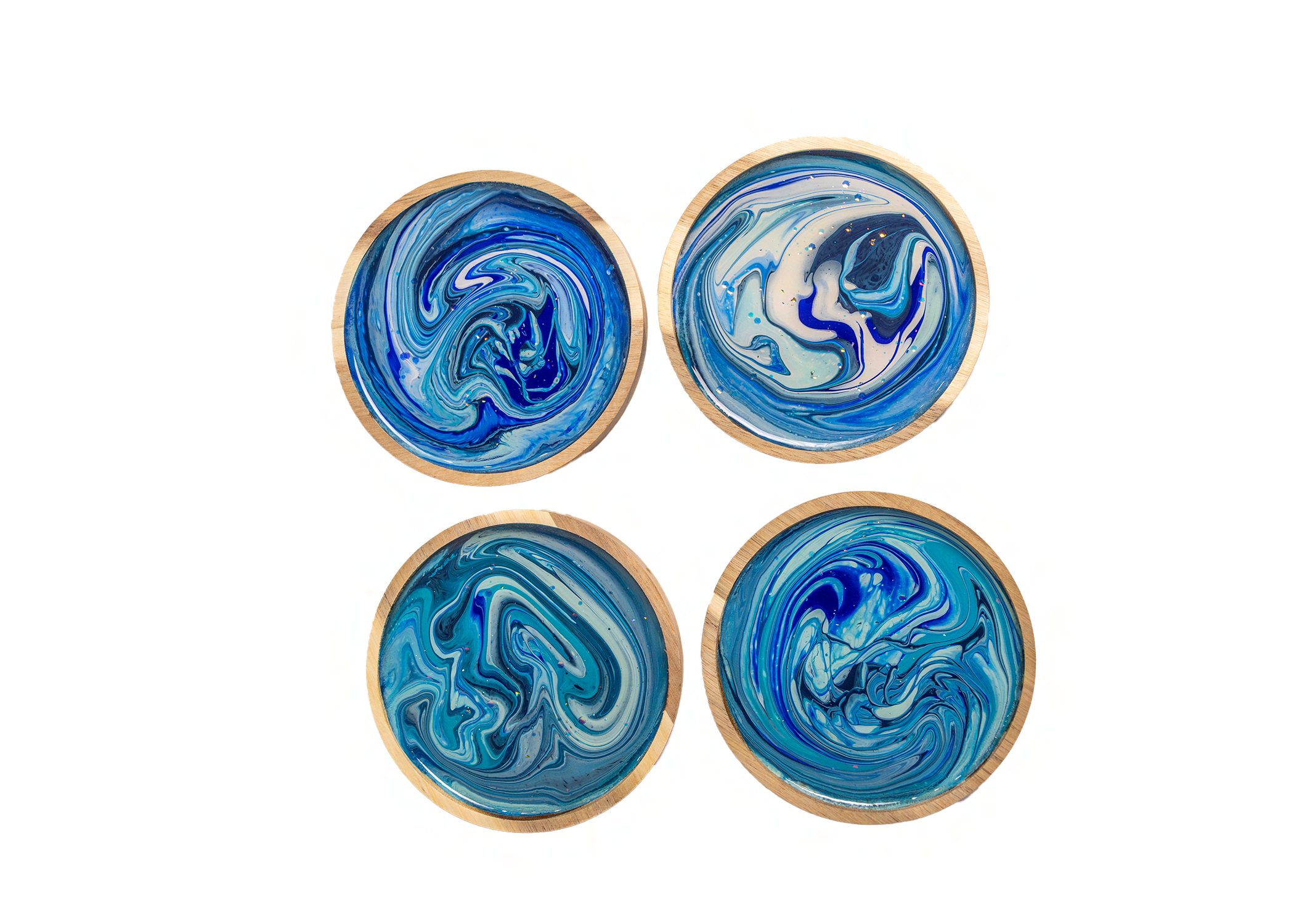 Premium acacia wood tapas set with a high-gloss resin finish. Functional, artistic, and perfect for small snacks, jewelry, soap, or as beautiful coasters around your home. Includes the full experience, all materials, and your finished set of 4 pieces.