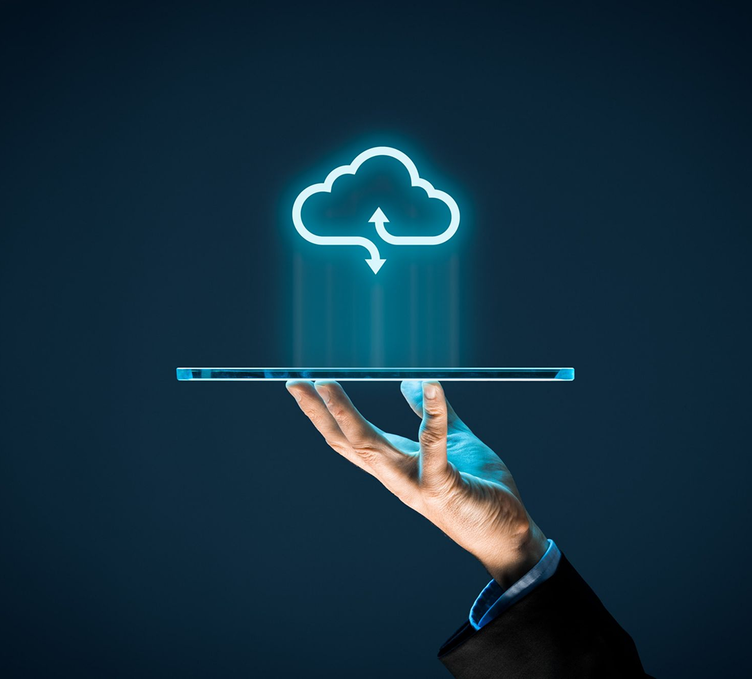 A hand holding a digital cloud symbol, reflecting Red X Carbon's mission for enterprise cloud modernization.