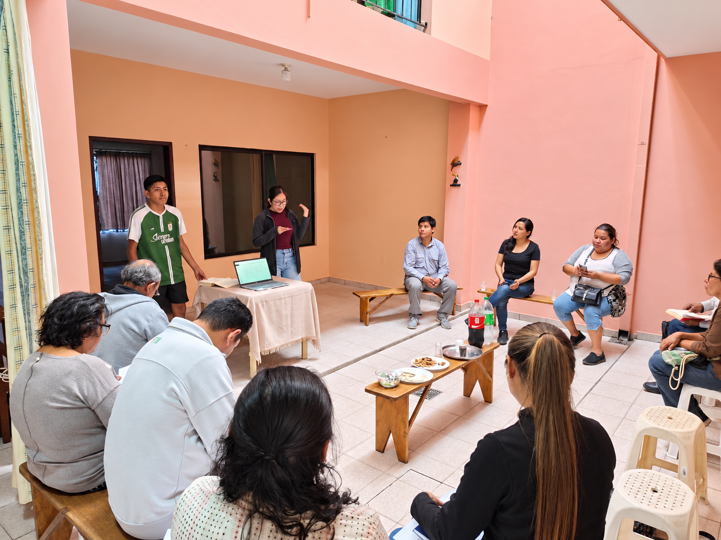 A group meeting in a courtyard for a discussion.