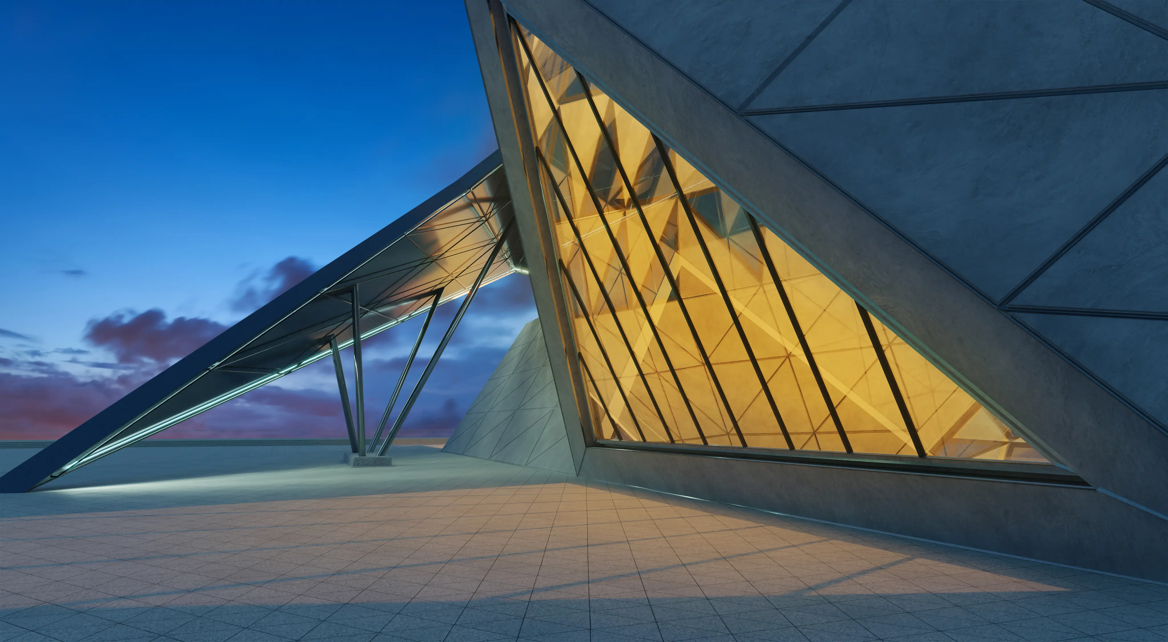 Modern architectural structure with angular concrete walls and large yellow-lit glass window at dusk.