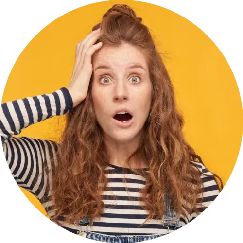 Woman with shocked expression holding head, representing business owner surprised by IT problems or unexpected downtime