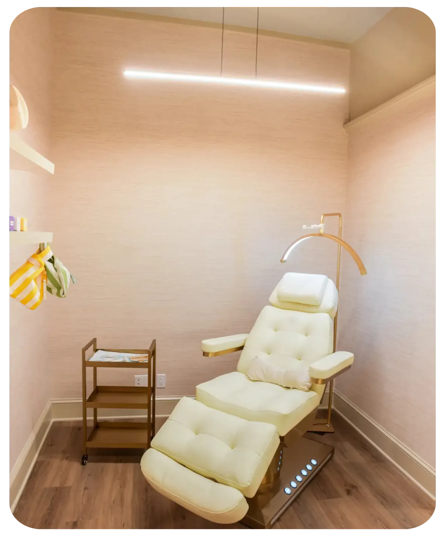 Modern cream reclining chair in a small room with wood floor and soft lighting.