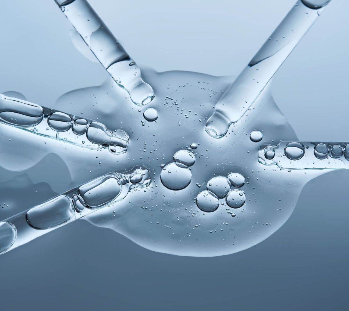 Clear peptide solution drawn with pipettes during independent third-party purity testing in a laboratory