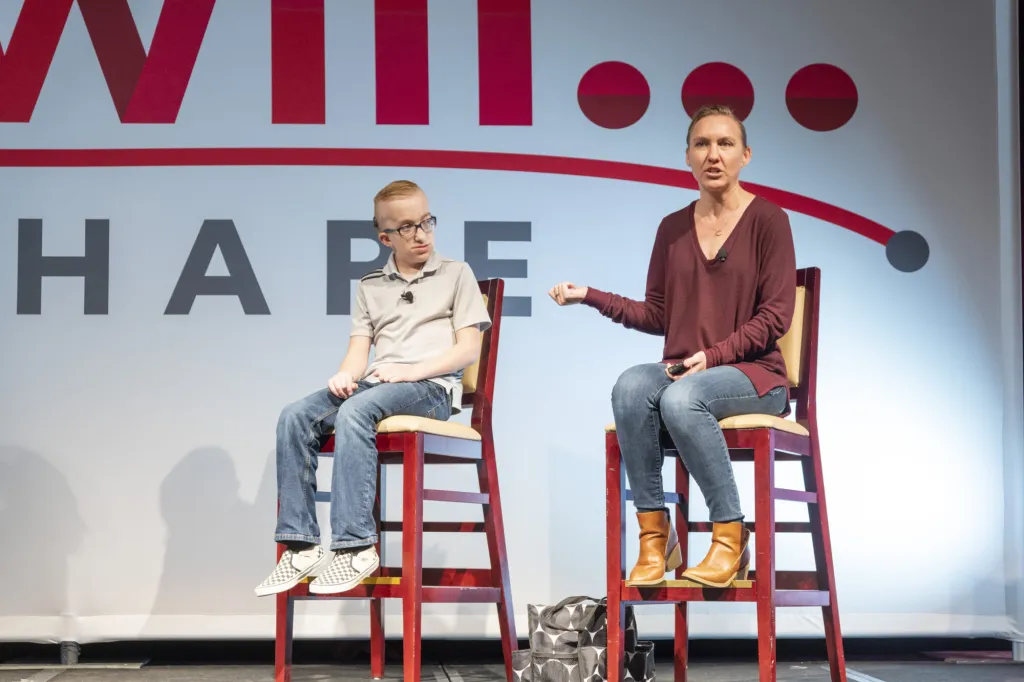 Two speakers seated on stage during a Speakers' Bureau event