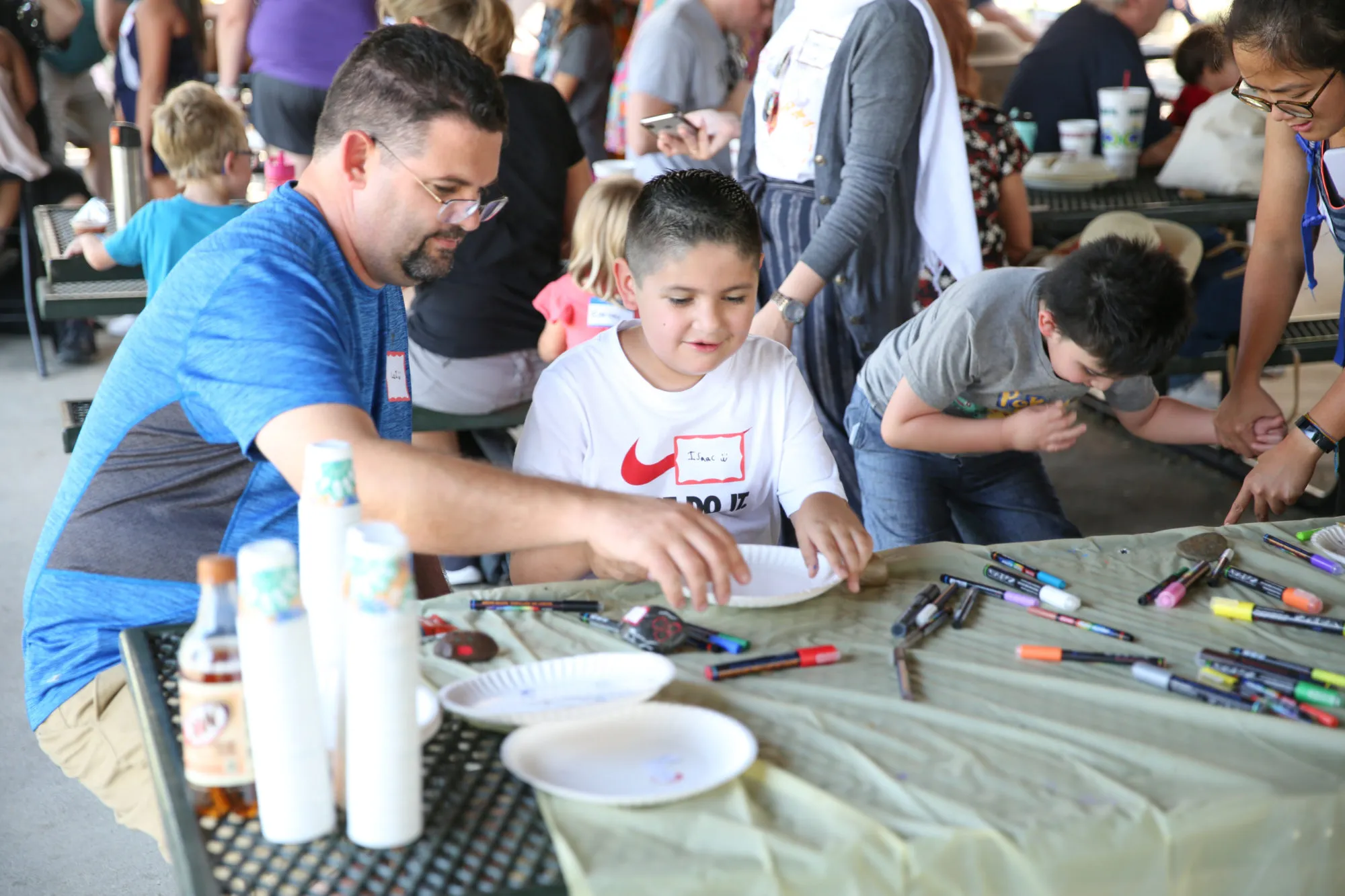 Volunteers showing colors and water at a CAM outdoor event