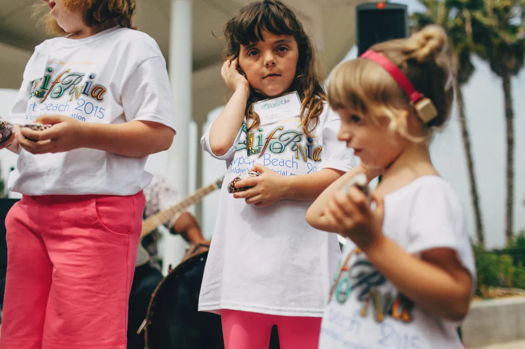 Children in matching CCA event t-shirts stand together