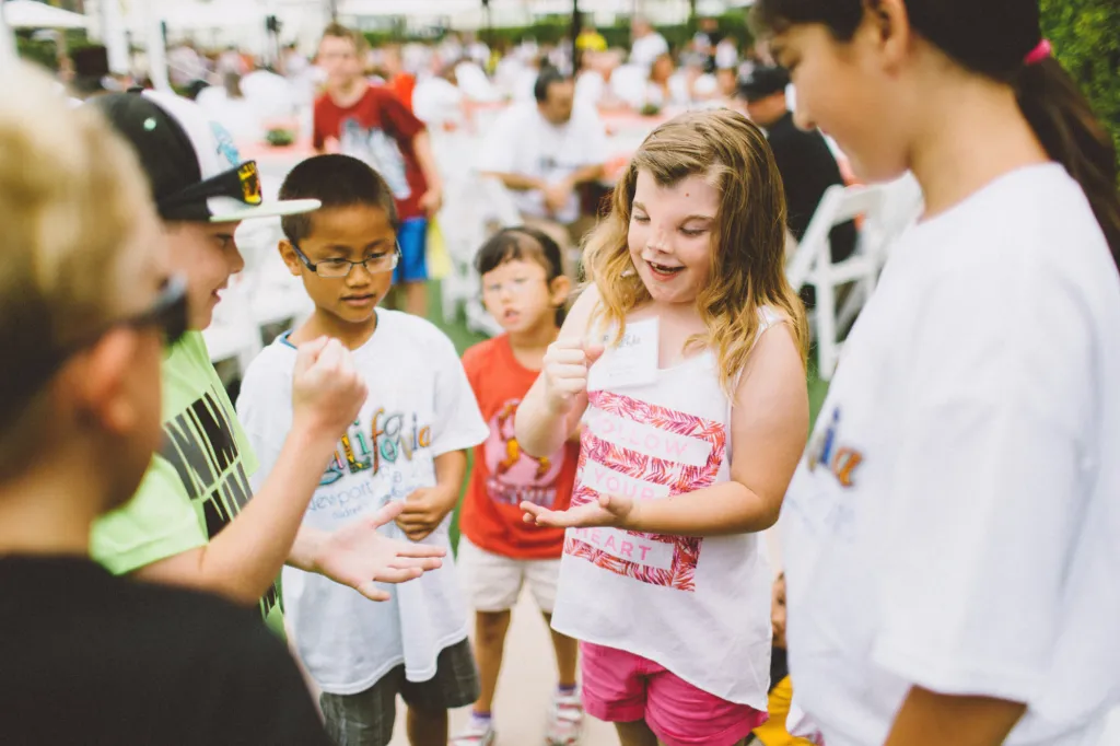 Children share snacks together at a CCA event