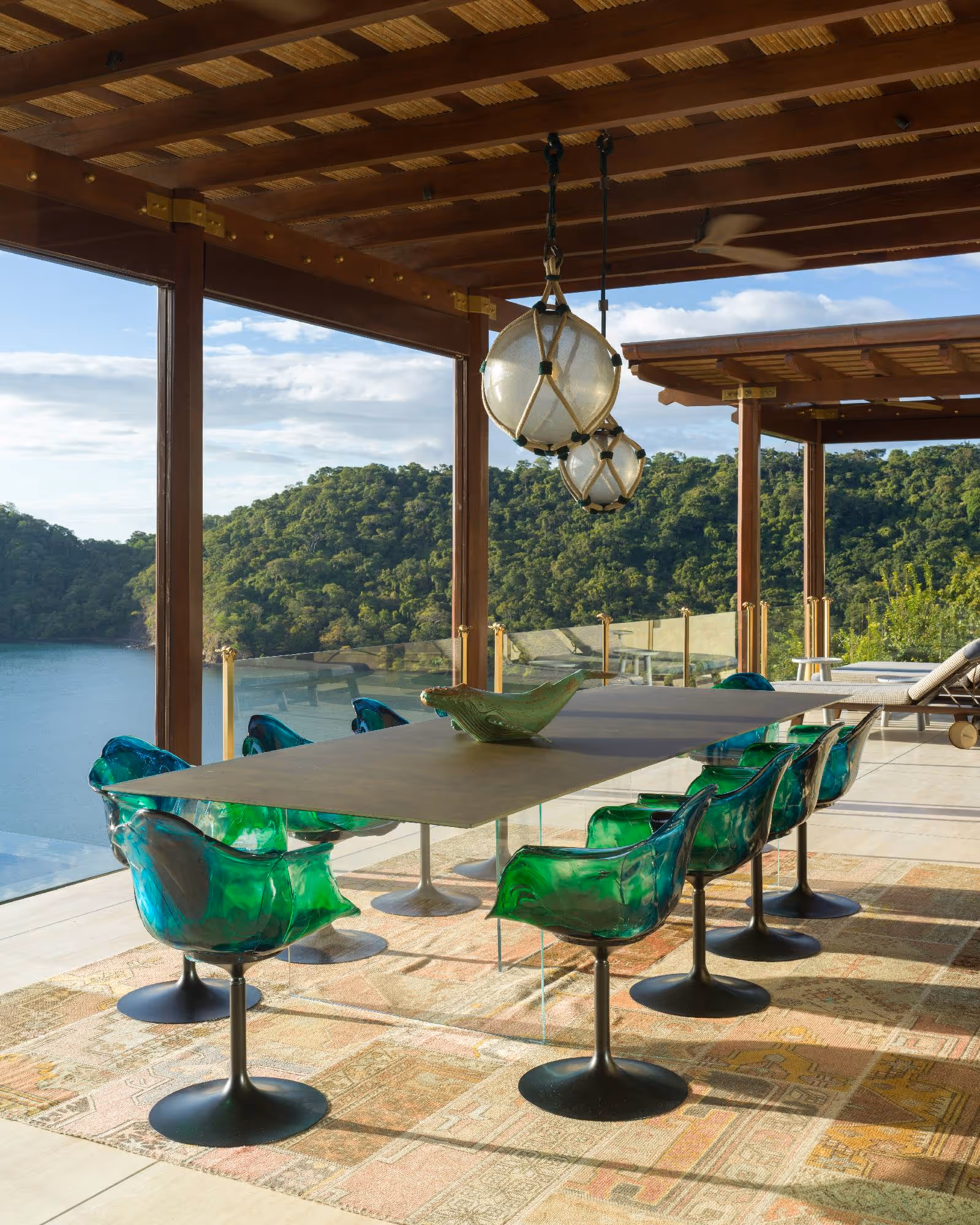 The Hive outdoor dining with green glass chairs