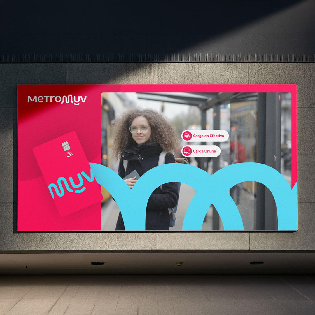 MetroMuv billboard with a woman at a bus stop and a MetroMuv card showing payment options.