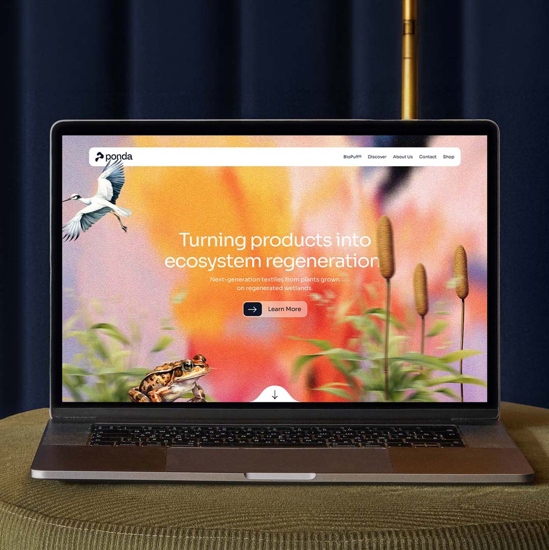 Laptop showing Ponda website with slogan about ecosystem regeneration and images of a bird, frog, and plants.