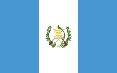 Flag of Guatemala featuring two crossed rifles, laurel branches, and a parchment with a quetzal bird on a blue background.