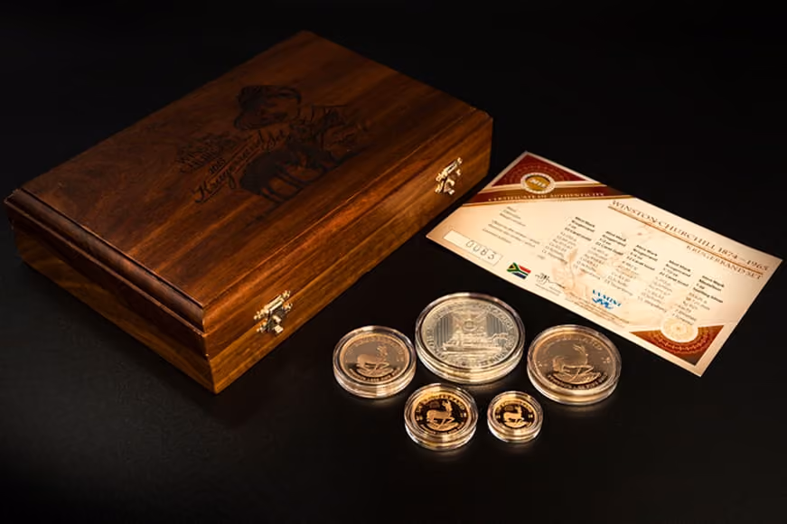 Limited edition gold coins next to case with certificate