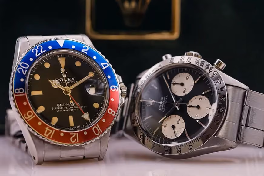 Investing in luxury watches, 2 rolex watches on a wooden table