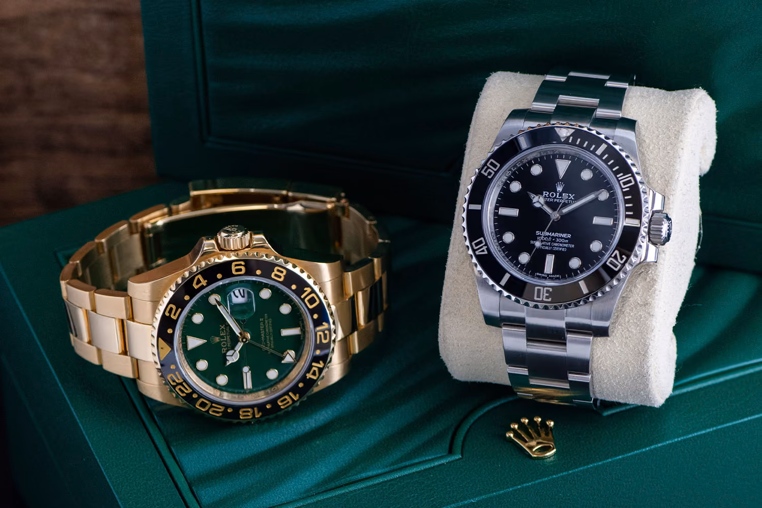 rolex submariner and gmt master on green rolex watch box
