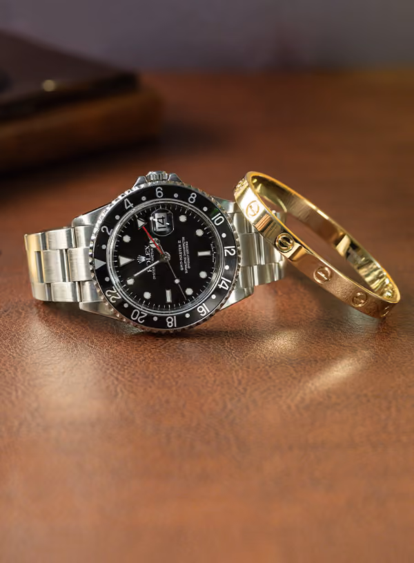 Rolex watch and Cartier bangle