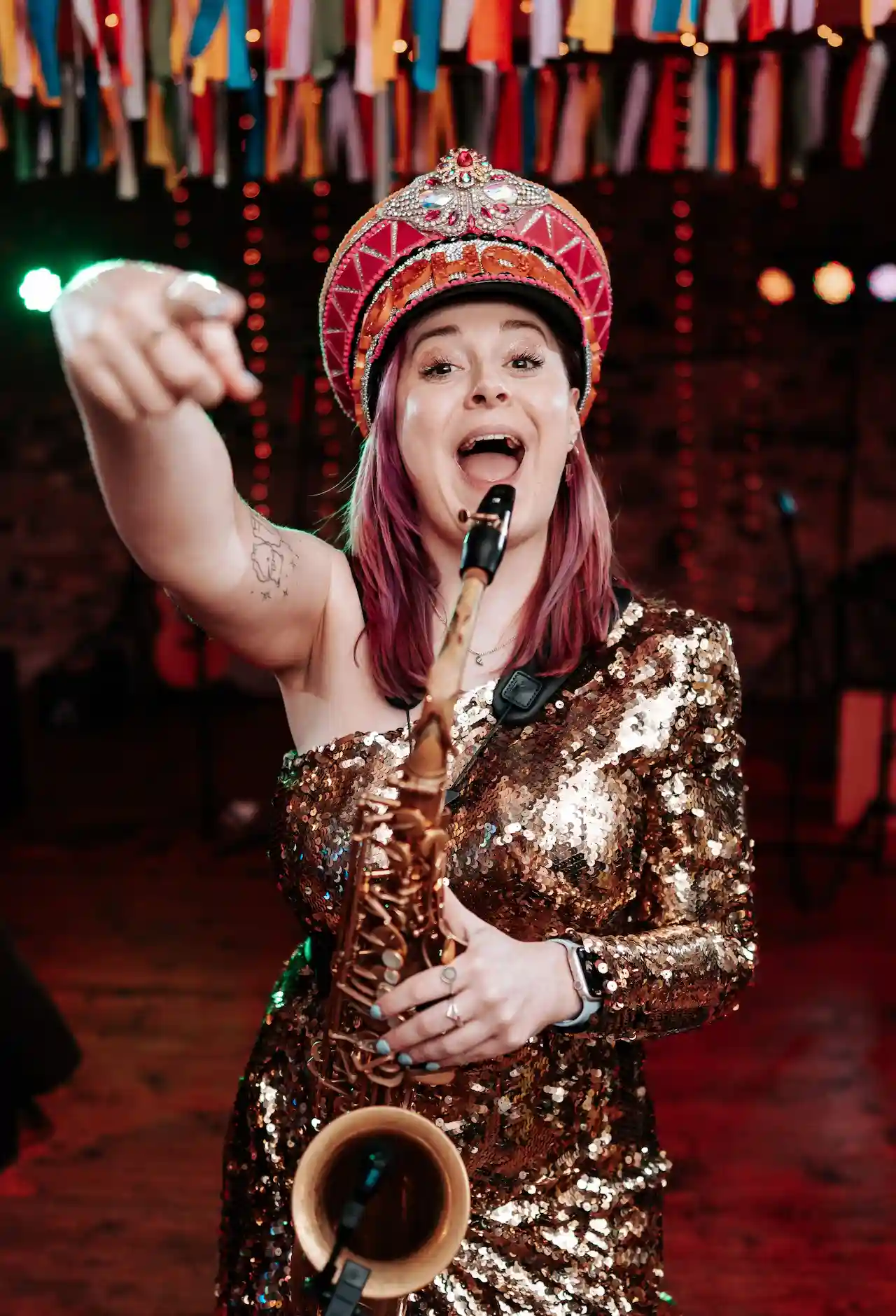 cat from saxophonique about me image, cat at a wedding pointing directly at the camera