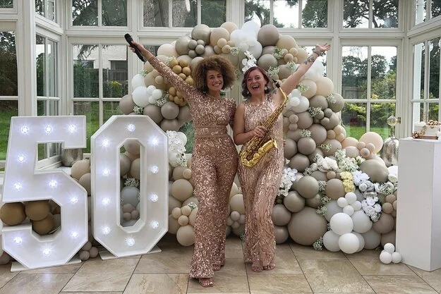 cat and franchesua sings at a daytime event
