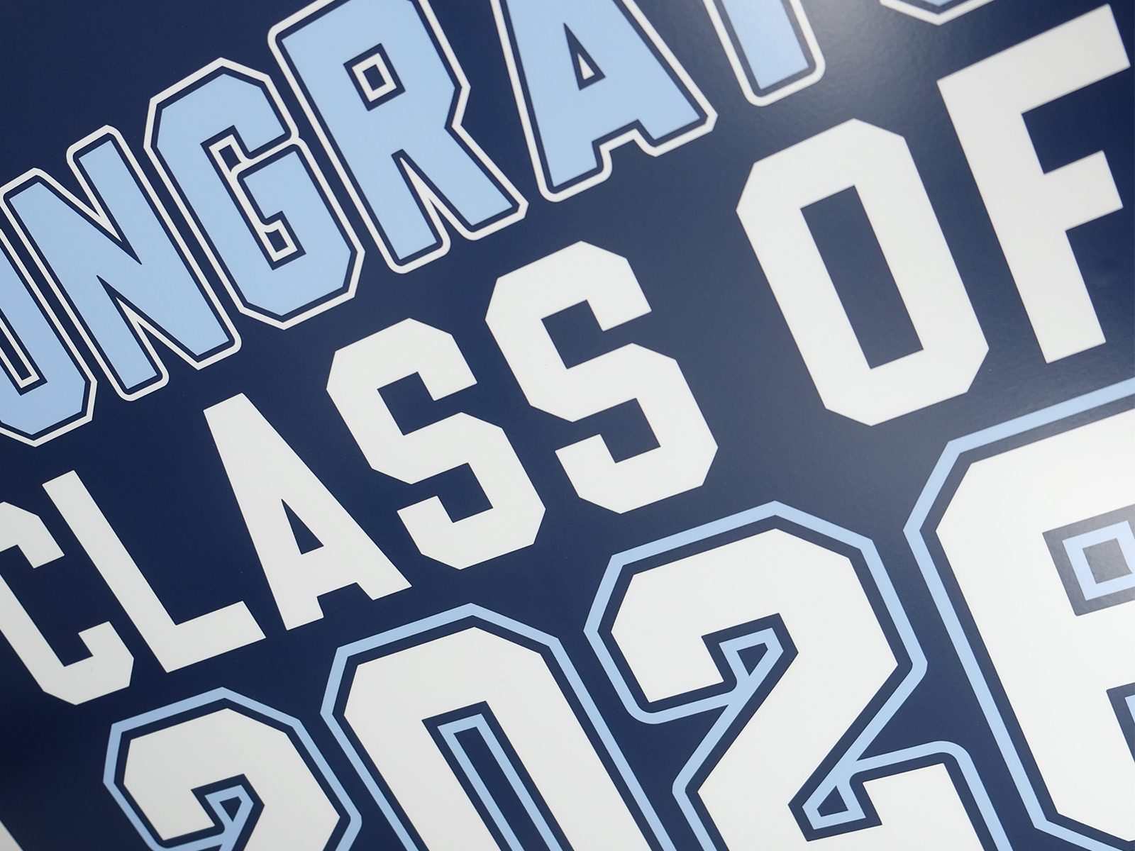 Custom vinyl wrap close-up, graduation theme