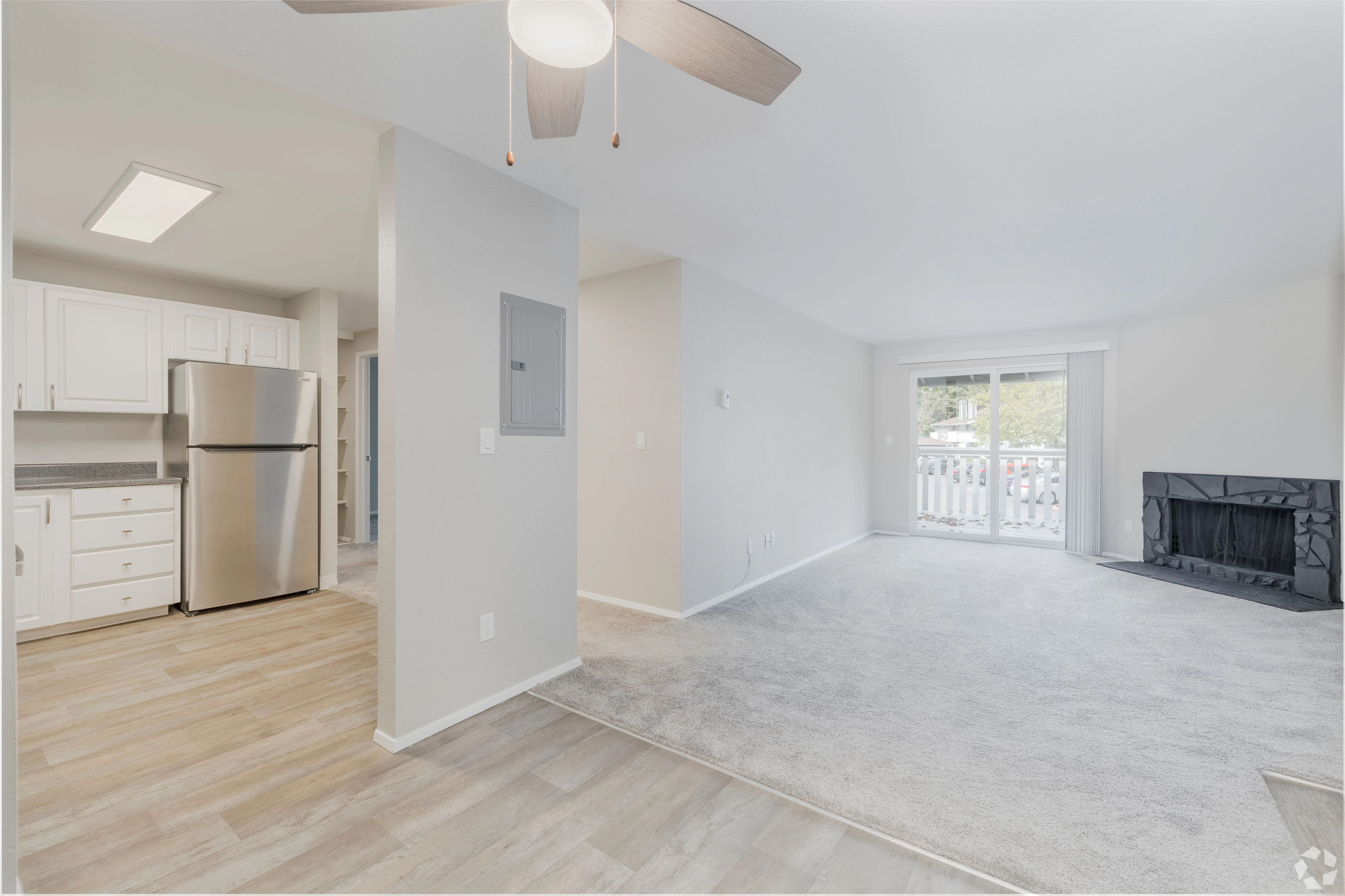 All white empty apartment with modern features and black accents