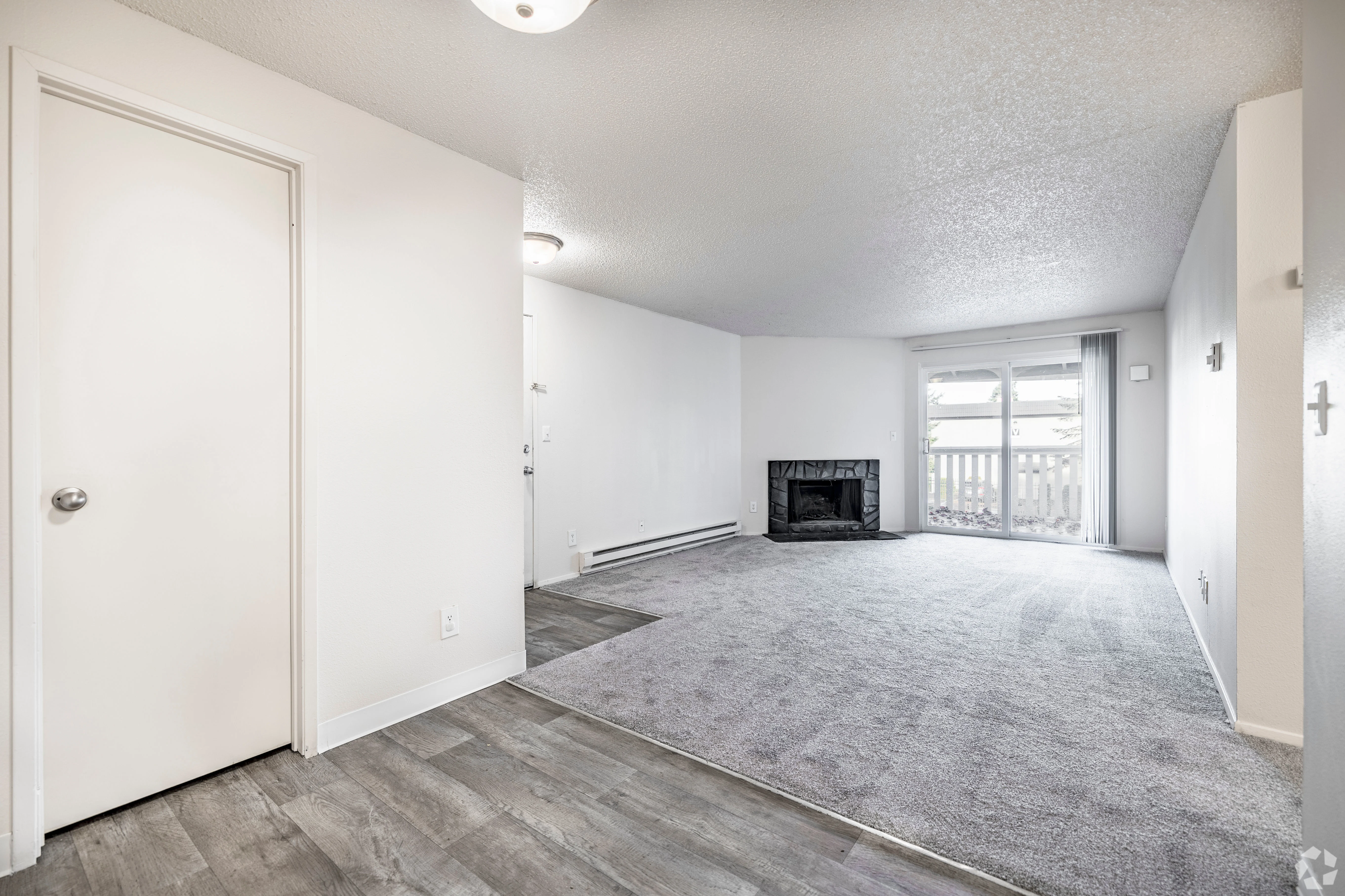All white empty apartment with modern features and black accents