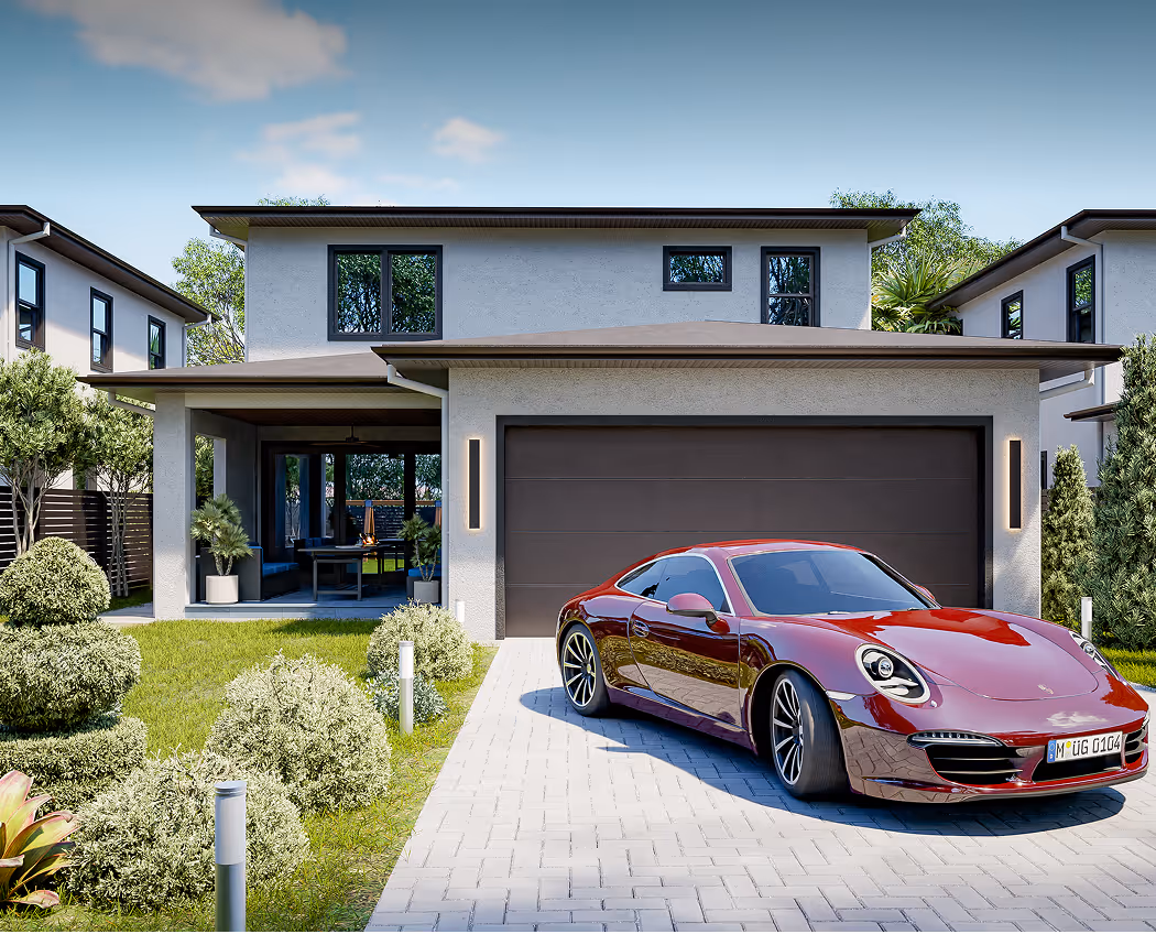 Modern two-story house with a gray facade and large windows, a brown garage door, and a red sports car parked on the driveway surrounded by green bushes and lawn.