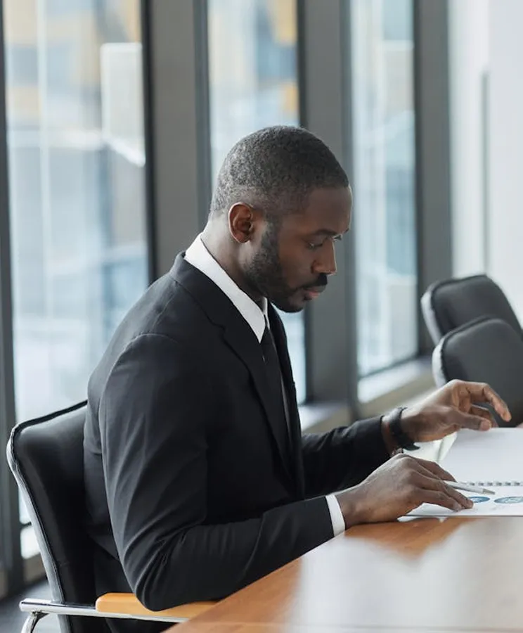 Executive reviewing documents in a modern office