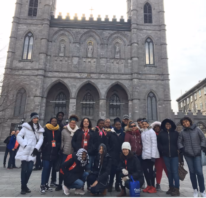 Students posing in front of Notre-Dame Basilica on school trip