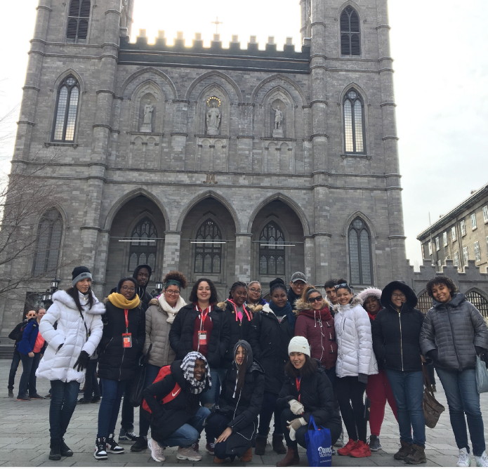 Students posing in front of Notre-Dame Basilica on school trip